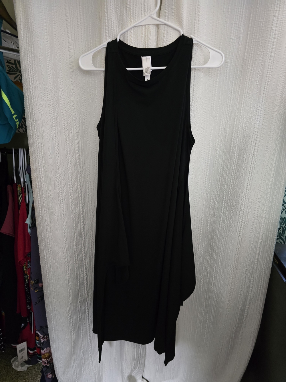 Sleeveless Black Tunic Top with Draped Hem